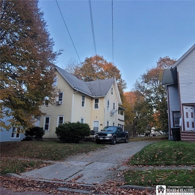 view of side of home featuring a yard