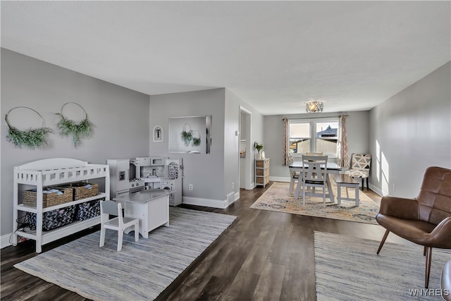 living room with dark hardwood / wood-style flooring