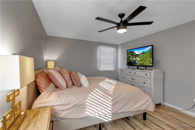 bedroom featuring light wood-type flooring and ceiling fan