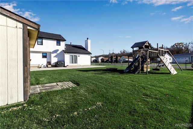 view of yard with a playground and a patio area