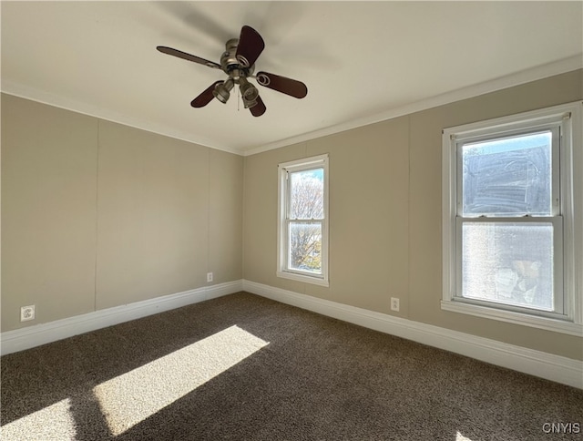 carpeted empty room featuring ornamental molding and ceiling fan