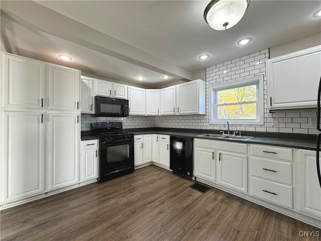 kitchen featuring black appliances, sink, dark hardwood / wood-style floors, and white cabinets