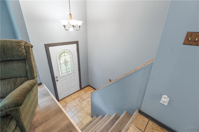 foyer featuring a notable chandelier and hardwood / wood-style flooring