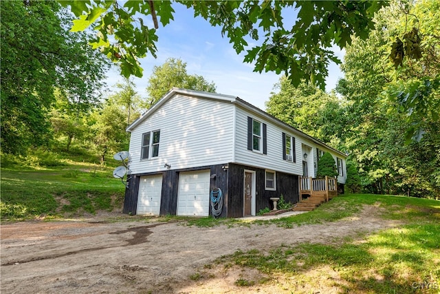 view of side of home with a garage