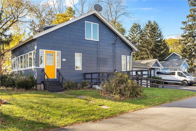 view of property exterior featuring a lawn