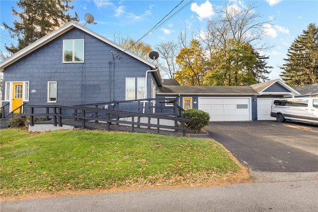 view of front facade featuring a front yard and a garage