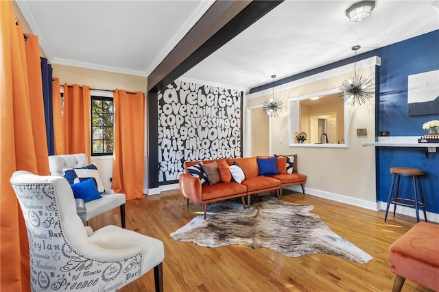 living room featuring beamed ceiling, wood-type flooring, indoor bar, and ornamental molding