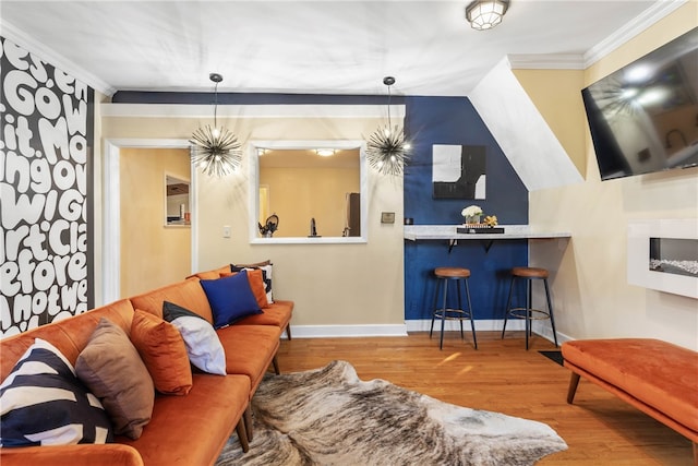 living room featuring wood-type flooring and crown molding