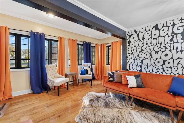 living room featuring light hardwood / wood-style floors and crown molding