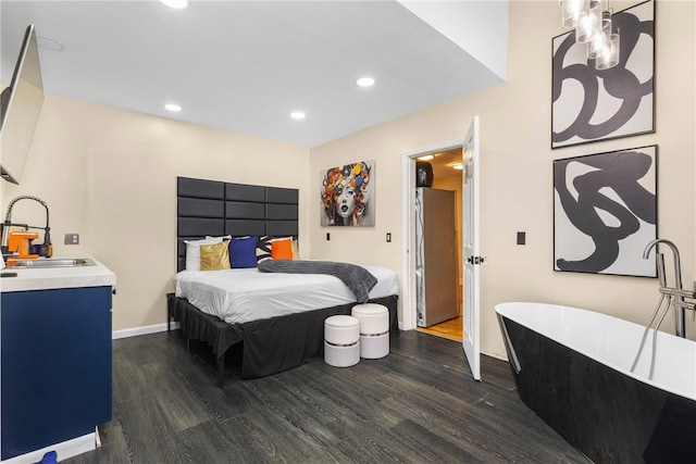 bedroom with dark hardwood / wood-style flooring and sink