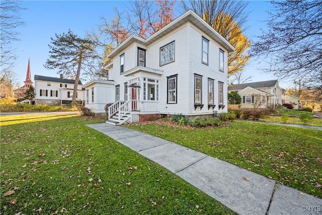 view of front of home with a front lawn