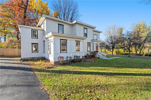 front facade featuring a front yard