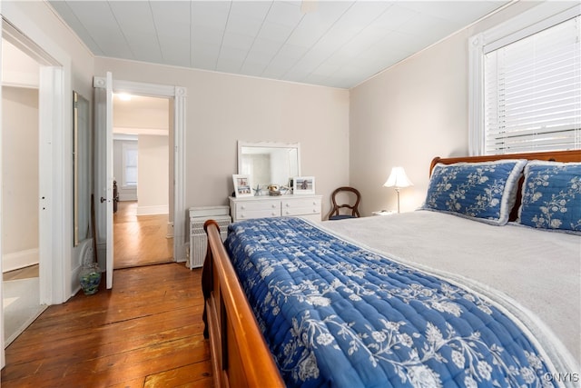 bedroom with wood-type flooring