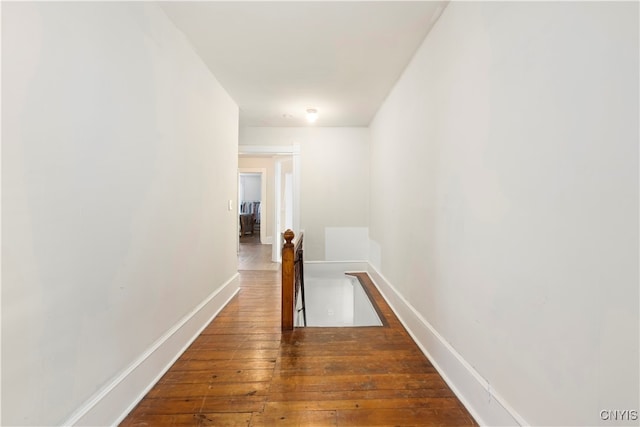 hallway featuring dark wood-type flooring