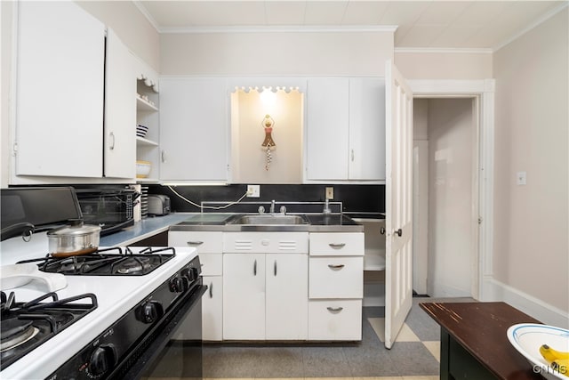 kitchen with stainless steel counters, white range with gas cooktop, ornamental molding, and white cabinets