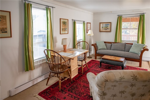 living room with plenty of natural light, carpet flooring, and a baseboard radiator