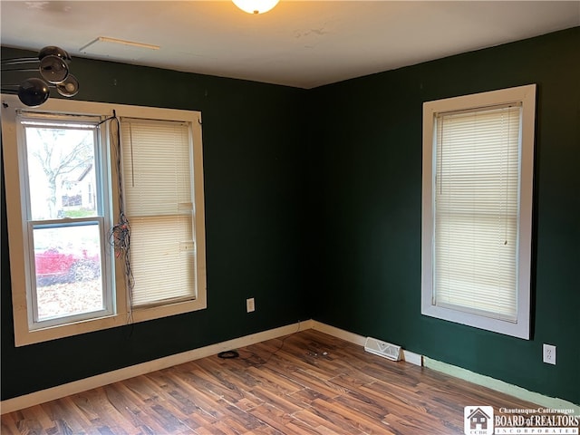 empty room with wood-type flooring