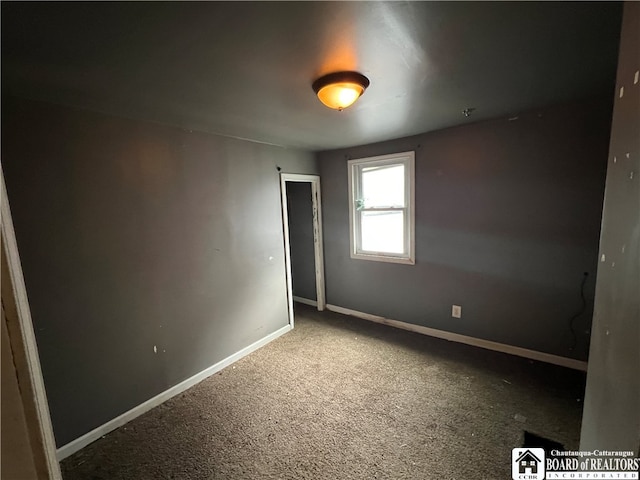 unfurnished room featuring carpet flooring