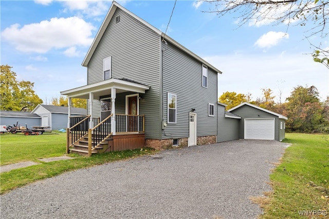 view of front of home featuring an outbuilding, a front lawn, a porch, and a garage