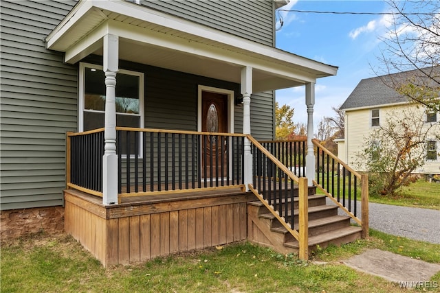 doorway to property with a porch