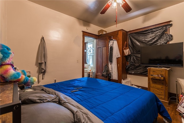 bedroom featuring dark hardwood / wood-style flooring and ceiling fan