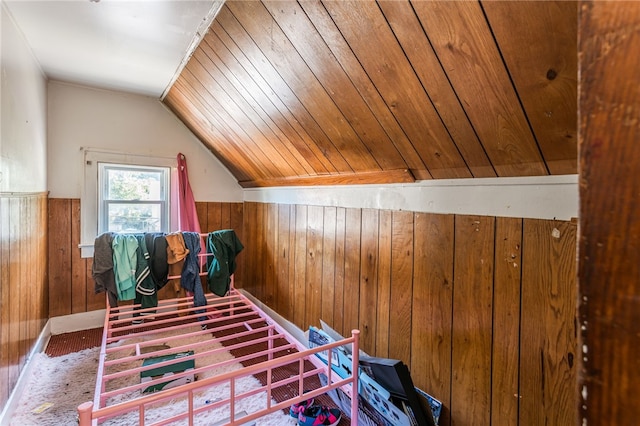 bonus room featuring wooden walls, lofted ceiling, and wooden ceiling