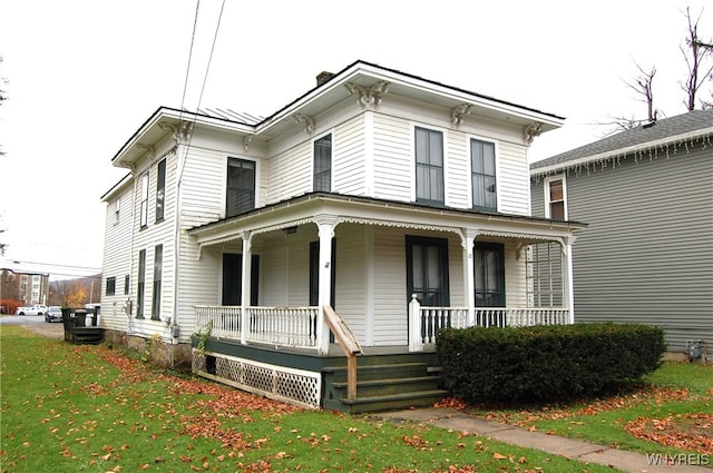 italianate house with a front yard and covered porch