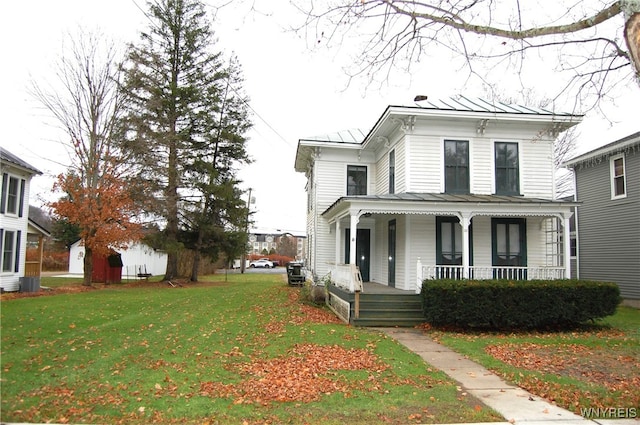 view of front of house with a porch and a front yard