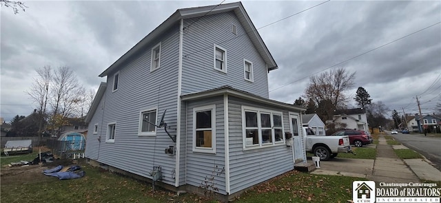 135 N 12th St, Olean, NY 14760 - view of property exterior featuring a lawn