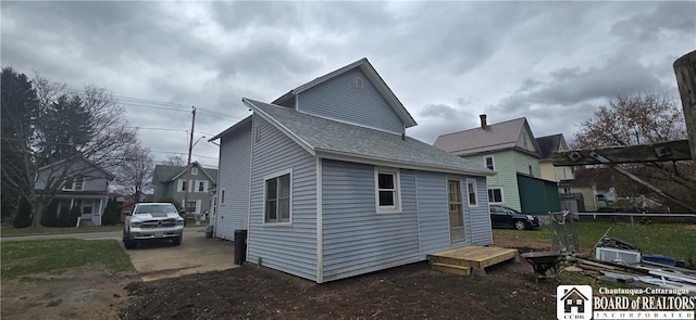 135 N 12th St, Olean, NY 14760 - view of side of property featuring roof with shingles