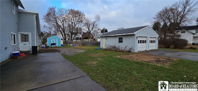 135 N 12th St, Olean, NY 14760 - view of yard with an outbuilding and a garage