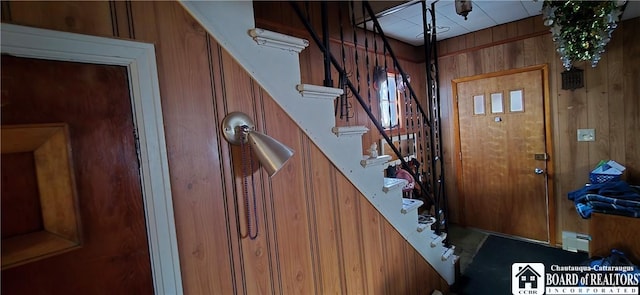 135 N 12th St, Olean, NY 14760 - foyer entrance with stairway, a baseboard radiator, and wooden walls