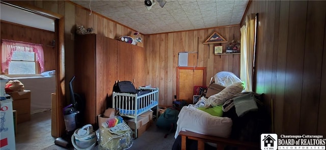135 N 12th St, Olean, NY 14760 - misc room with wood walls and carpet flooring