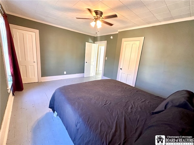 bedroom featuring ceiling fan, crown molding, and wood-type flooring