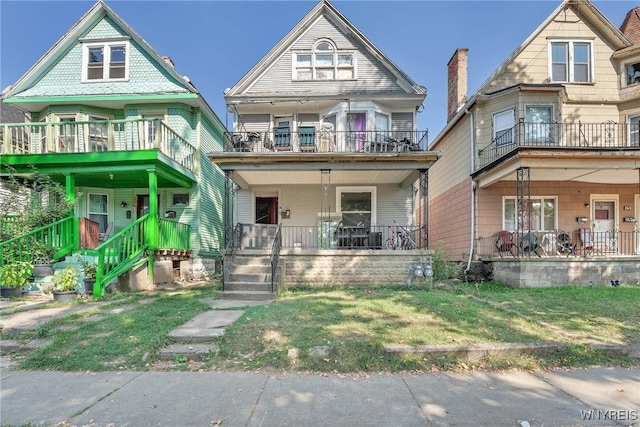 view of front of home featuring a balcony and a porch