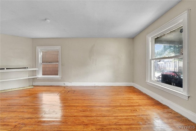 unfurnished room featuring light hardwood / wood-style flooring