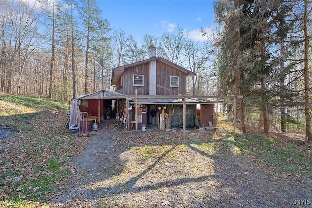 view of front of house with an outbuilding