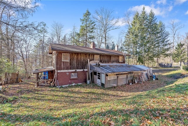 back of house with a yard