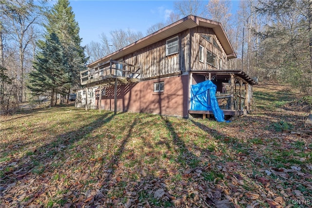 rear view of property featuring a yard