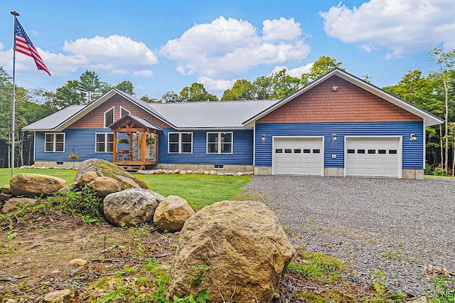 view of front of home with a front lawn and a garage