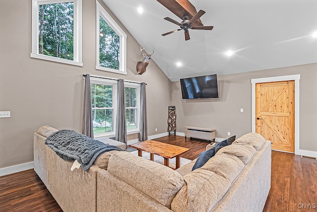 living room featuring dark wood-type flooring, ceiling fan, and a healthy amount of sunlight