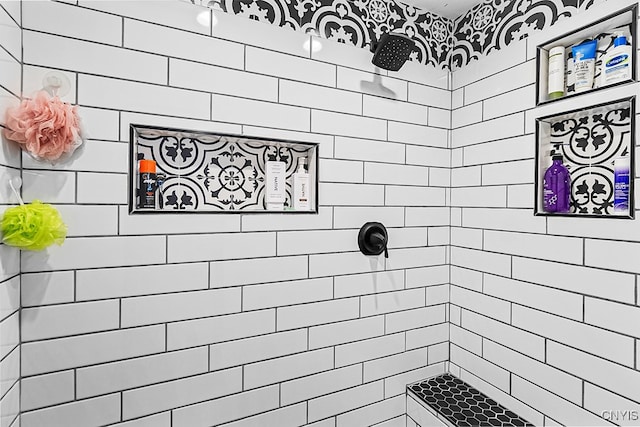 bathroom with a tile shower