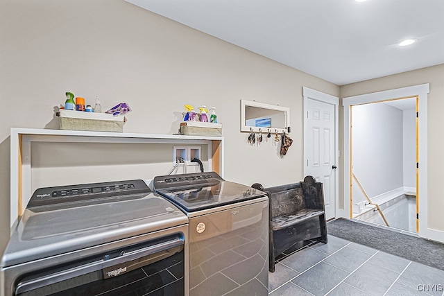 clothes washing area featuring independent washer and dryer and light tile patterned floors