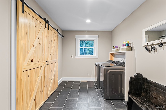 clothes washing area featuring washer and dryer