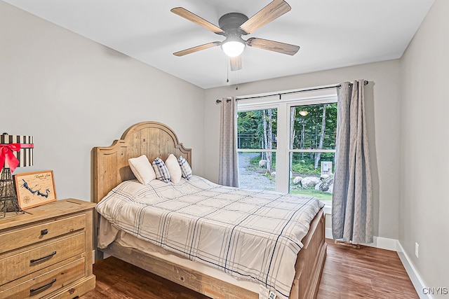 bedroom featuring ceiling fan and dark hardwood / wood-style flooring