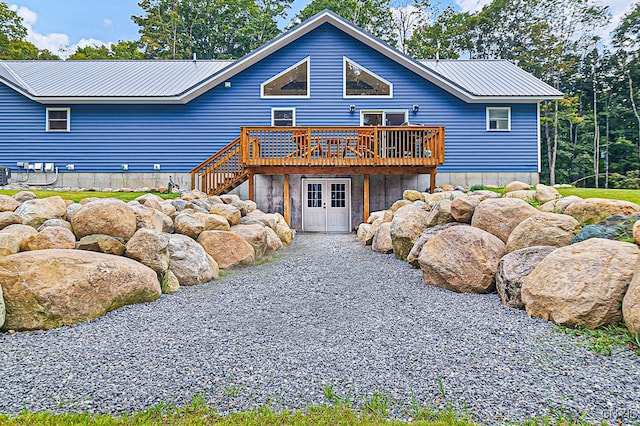 back of property with a wooden deck