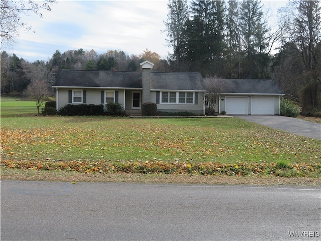 ranch-style home featuring a garage and a front yard