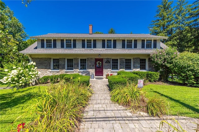 948 George St, Wheatland, NY 14511 - colonial-style house featuring a front lawn, a chimney, and stone siding
