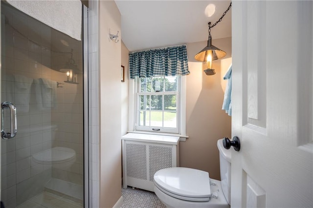 948 George St, Wheatland, NY 14511 - bathroom featuring toilet, radiator, a stall shower, and tile patterned flooring