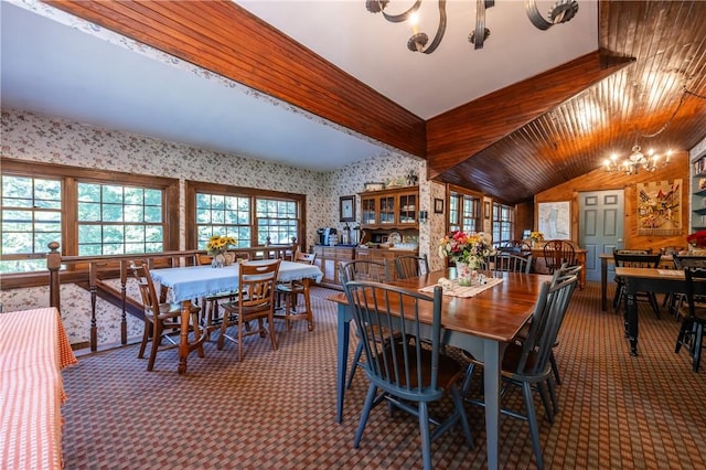 948 George St, Wheatland, NY 14511 - dining space featuring a chandelier, carpet, wallpapered walls, and vaulted ceiling